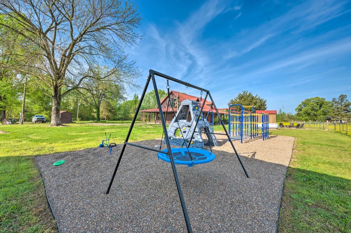 Whits End Cabin playground swing and climbing wall